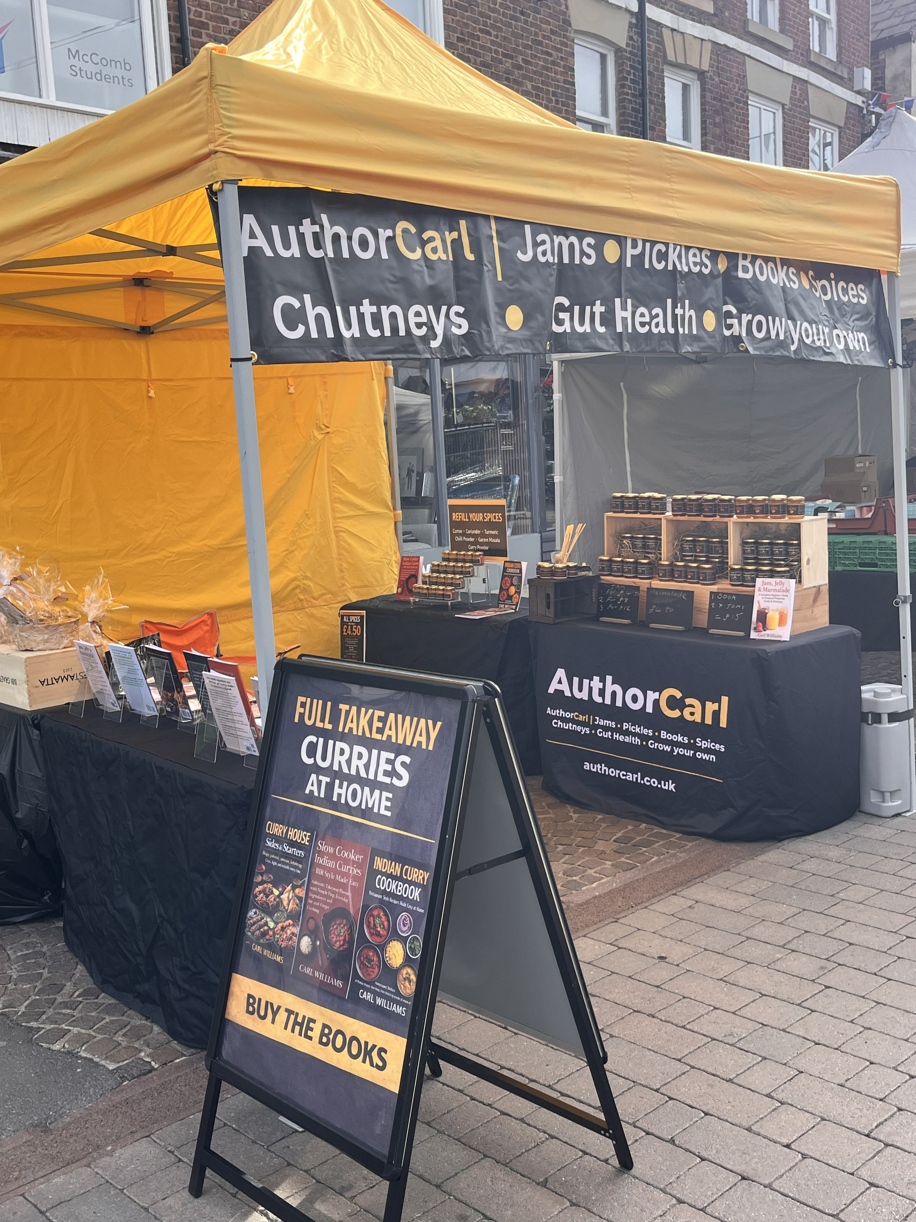 Author Carl market stall with yellow gazebo